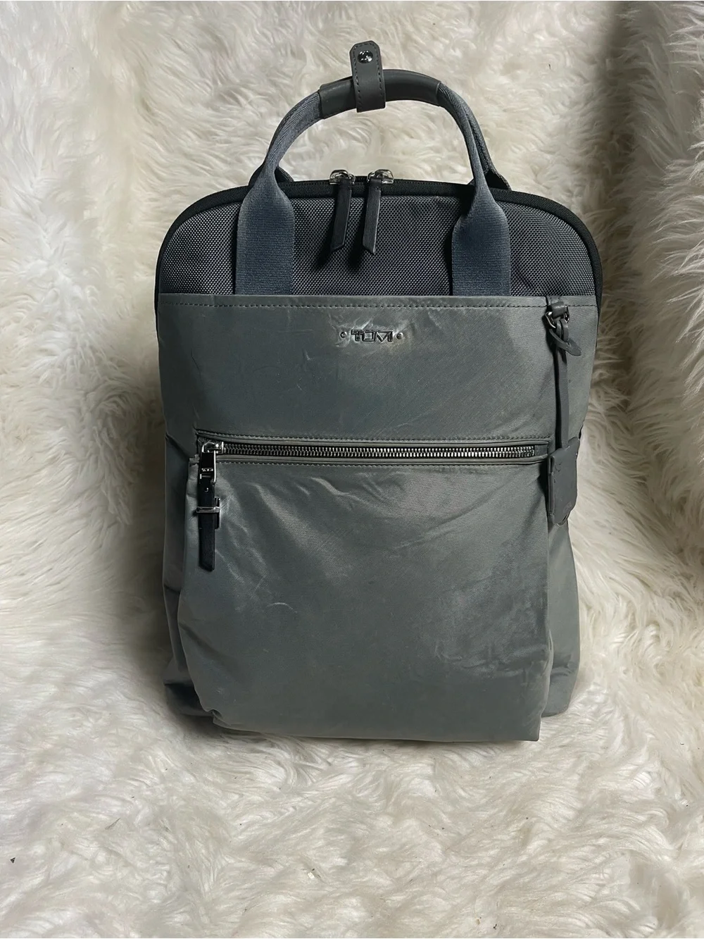 Tumi Voyageur Halsey nylon Gray Backpack with leather Top Handles.
